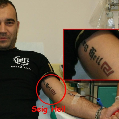 SEIG HEIL nazi tattoo of Golden Dawn Parliament- member Panagiotis Heliopoulos